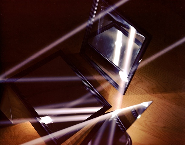 Light reflecting off three mirrors