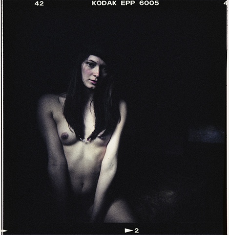 classic night time portrait of a young nude woman
