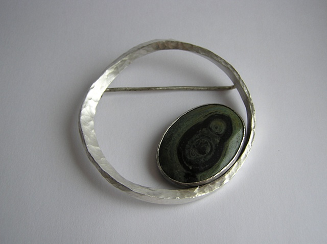 Forged and fabricated, the large cabochon stone and finish can vary.