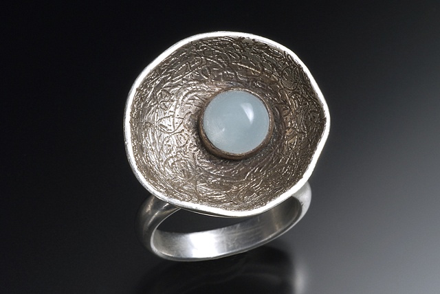 Silver is etched and oxidized.  This piece can be created with any stone.