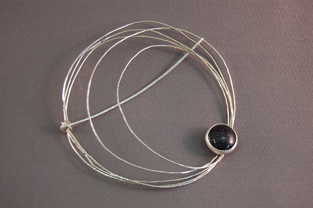 This delicate piece looks great on any sweater or shirt. Various cabochon cut stones and dimensions are also available.