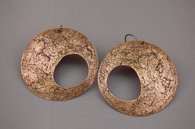 Formed and etched copper. Also available in forged sterling silver.