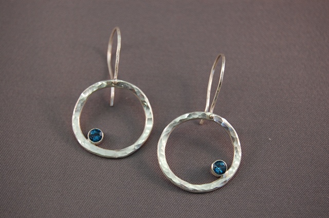 Forged and fabricated, these earrings are available with a variety of stones and finishes.