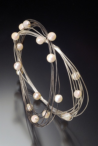 Pearls are classic for the bride, but these are great bangles you'll wear with everything. Also available in gold-filled and 14k gold.