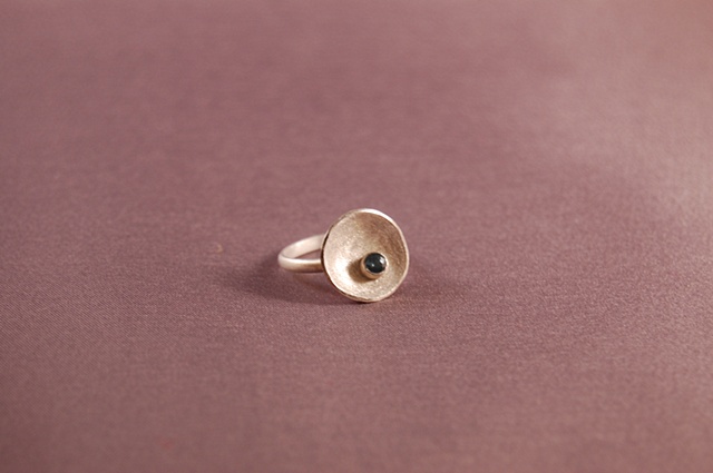 This ring is available with a variety of faceted and cabochon cut stones and many finishes.