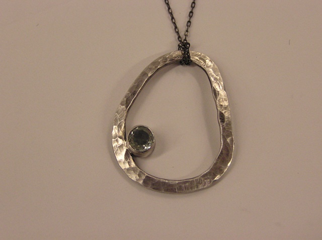 Forged and fabricated, this piece is available with faceted or cabochon cut stones.