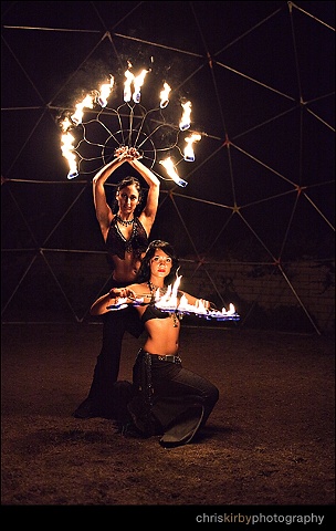 Performing with large Lotus fans,