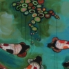 koi with black faces in blue and green