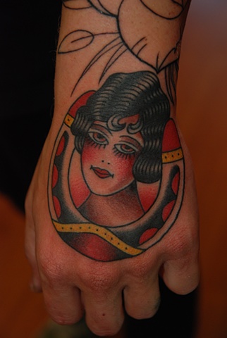 girl head/horseshoe