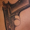 Gun tattoo
