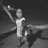 Young Boy Under A Streetlight