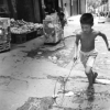 Boy Playing With A Hoop