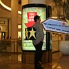 Photograph from performance standing by a kiosk in the Westfield Mall.
