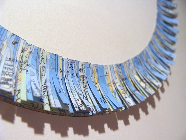map collage made with strips of polar region maps titled Impact from the Uncharted Series for the exhibition Aggregate at the ICA (MECA) in September 2009 by Shannon Rankin