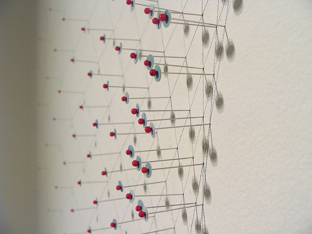 Installation using maps and pins for the show titled Maps at June Fitzpatrick Gallery by Shannon Rankin