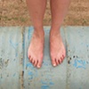 Danielle Rolling over Sand