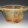 Oval pottery with nails and handles