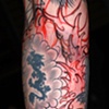 Tying together old tattoos with hand drawn waves, in progress. Photo taken before the lining process, it's a good example of my approach to filling in large, irregular areas in a composition and establishing a flow and balance to the design.