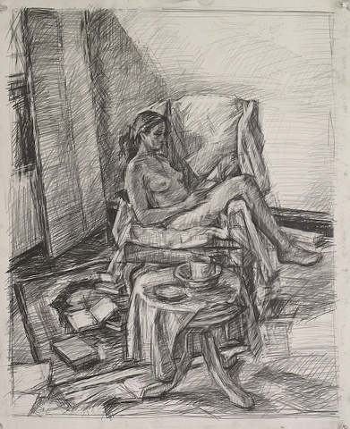 seated figure reading