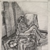 seated figure reading