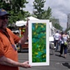 Summer Art Market with fellow artist, Tim McKay, holding one of my paintings