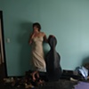 Sarah Taylor with cello and 80's poster