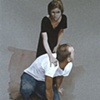 Woman Standing Over Man