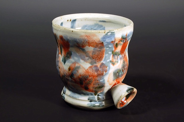 thrown stoneware cup with slip, cone 10 reduction