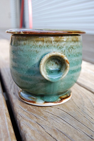 thrown porcelain tea bowl, celadon glaze, cone 10 reduction