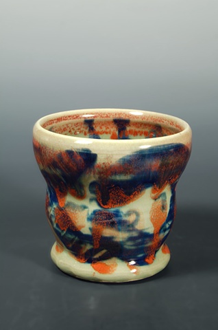 thrown porcelain tea tumbler, cobalt and iron slip decoration, blue celadon glaze