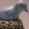Bluebird vessel with eggs inside.