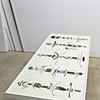 One hundred pieces of metal I found on the ground as arranged by Micah Lexier
