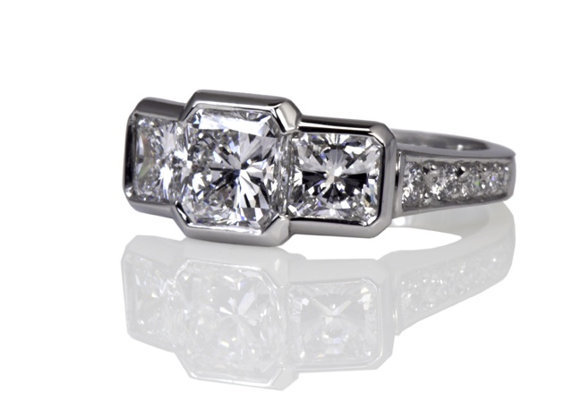 Radiant Cut three stone ring with pave set shoulders
