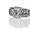 Radiant Cut three stone ring with pave set shoulders