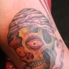 Skull on inside arm.