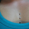 three healed dermal anchors on the chest