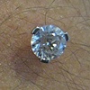 healed nape piercing with freshly changed prong set cz's