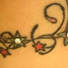 Two fresh dermal anchors in star tattoos(zoomed in)
