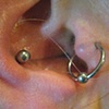fresh piercings for the tragus to conch industrial.  This is the same jewelry that was used to do the piercings on the left ear.