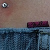 Two fresh dermal anchors on the back dimples. (zoomed in view)