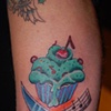 Cupcake with crossed knife and music staff