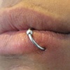 fresh RE-DO lip piercing with a ring. little or no redness after the piercing was done...not uncommon with the re-do.
