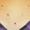 Samantha's 7 healed dermal anchor's on chest