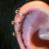 Three 4 week old cartilage piercings.  Three marks for three more piercings about to be done.