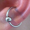 fresh conch piercing with a captive bead ring.  SUPER RED, which is not at all uncommon for a fresh conch piercing
