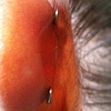 Here is a photo that shows what the Illusional looks like behind the ear.  Just the two disc backs are behind the ear.  The disc backs allow for comfort when sleeping on the side that the ear is on.