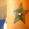 Fresh dermal anchor on a wrist tattoo