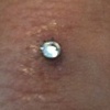 Fresh 18 gauge anchor with bezel set CZ on the finger.(zoomed in view)