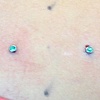 Two fresh dermal anchors on right shoulder blade area.  Two more to come. Sorry for the blurry photo, alas I am not a photographer:(
