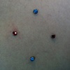 Four healed anchors on the right shoulder.  Two tops are freshly changed.